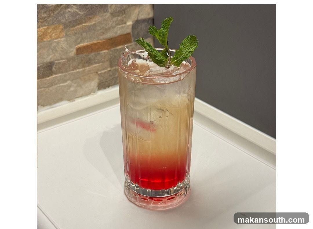 Retro Glass Cocktail with Mint Garnish