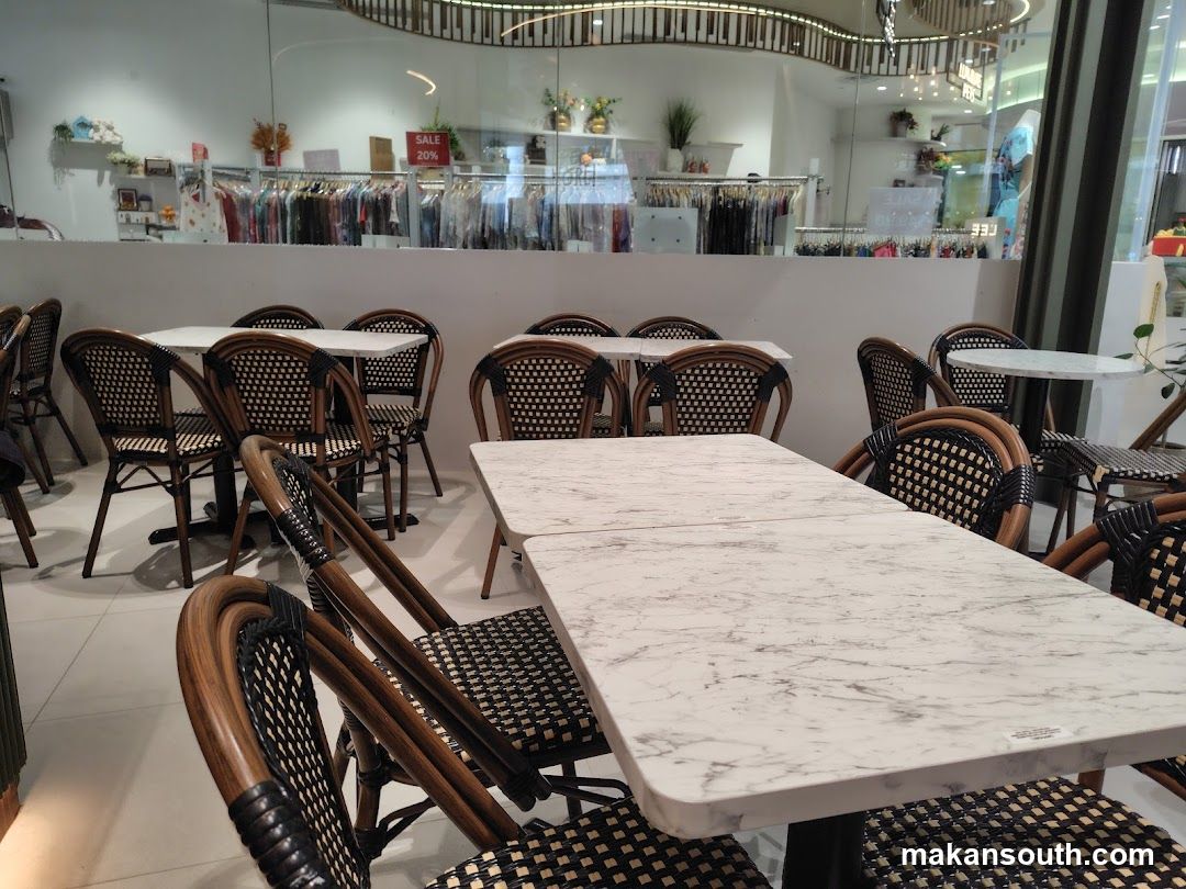 Interior of a clothing store with seating area