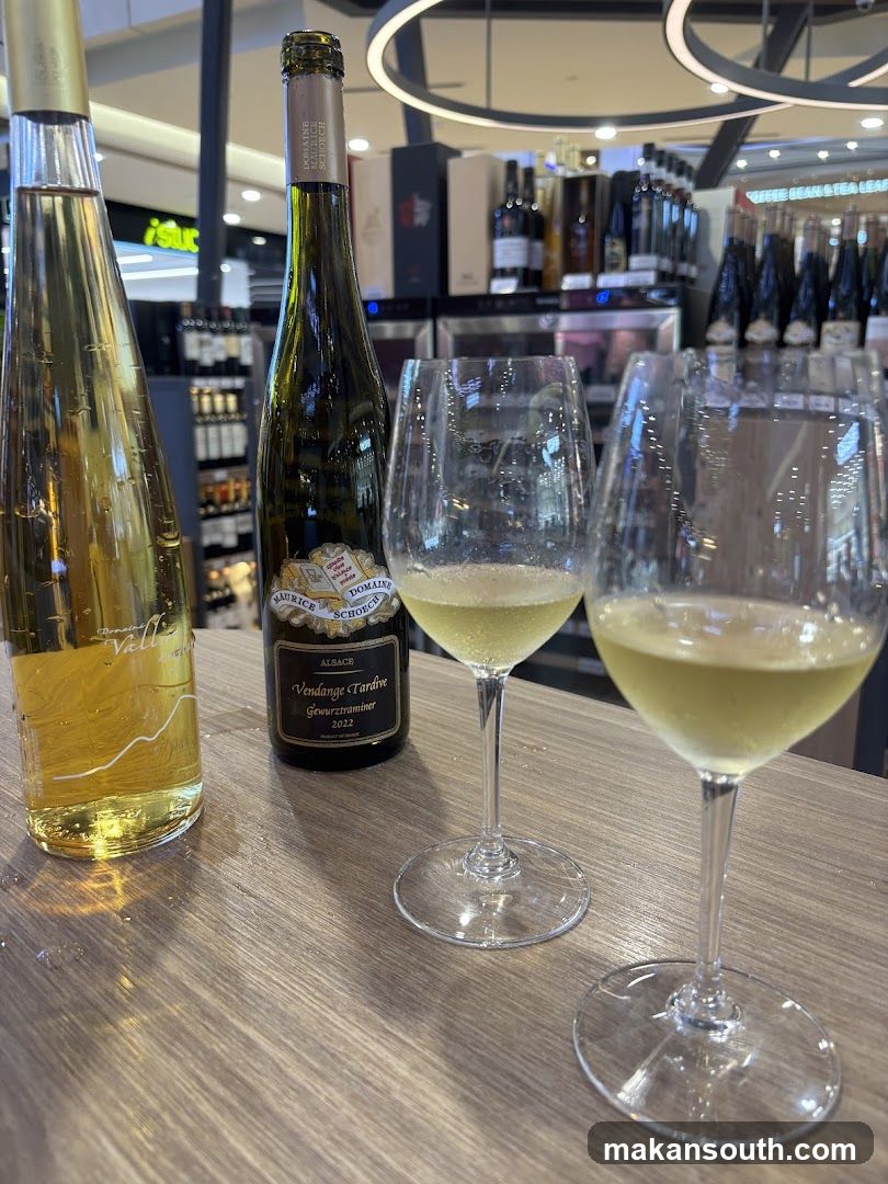 Wine bottles and glasses on a table in a store