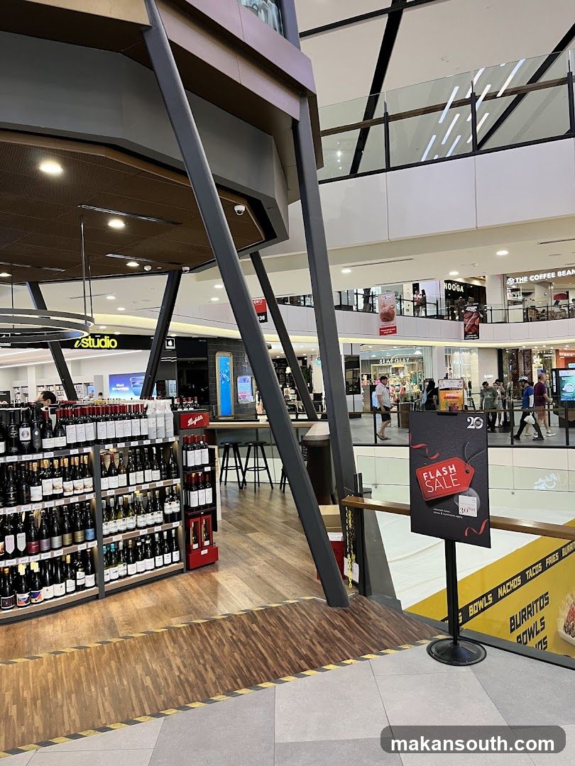 Shopping Mall Interior with Wine Store and Flash Sale Sign