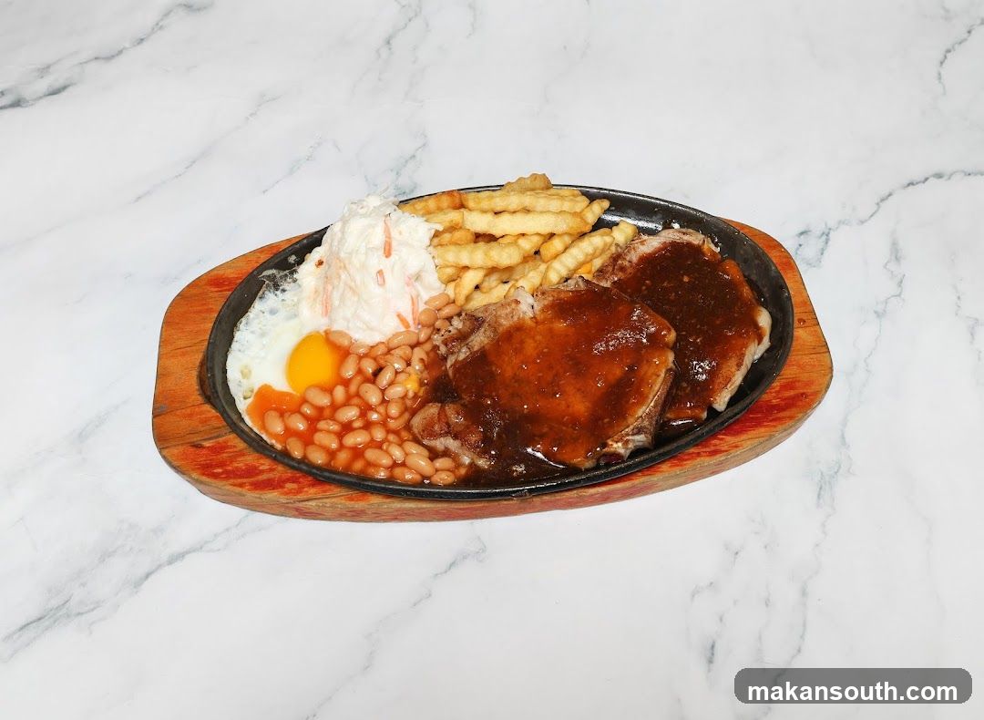 Sizzling Steak Platter with Fries, Beans and Egg