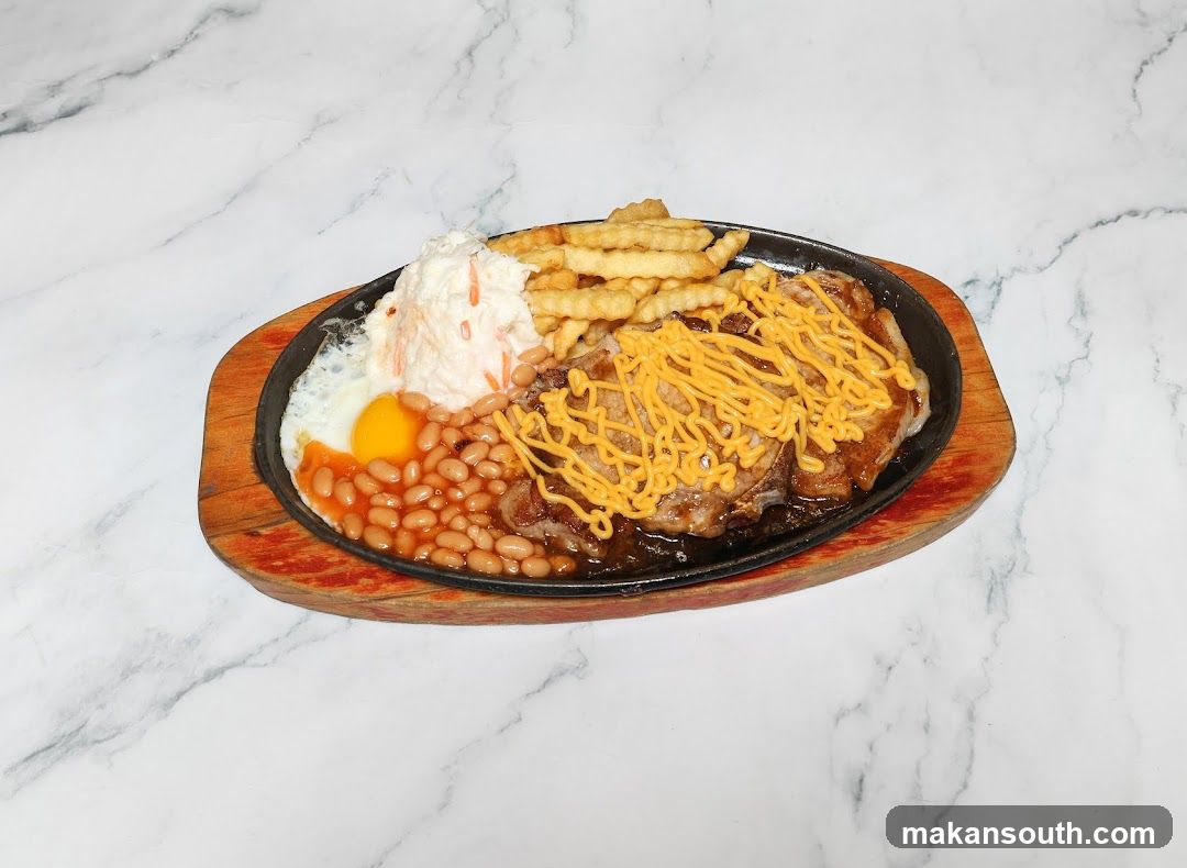 Sizzling Steak Platter with Fries, Beans and Egg