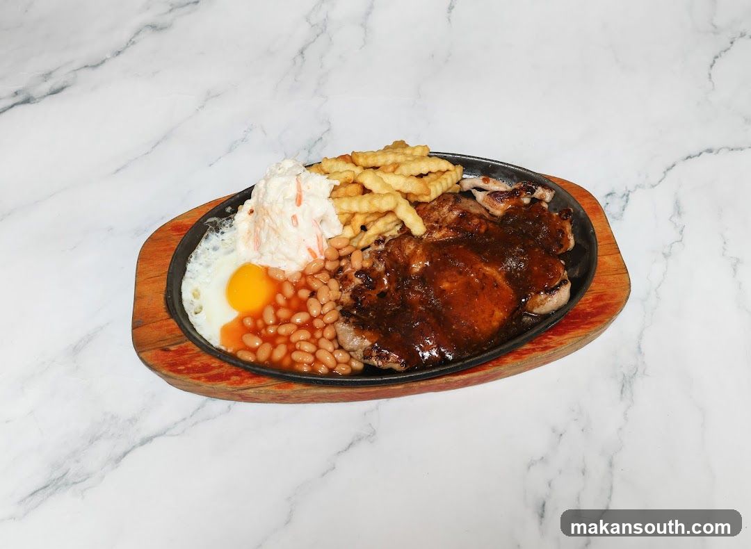 Sizzling Steak Platter with Fries, Beans and Egg