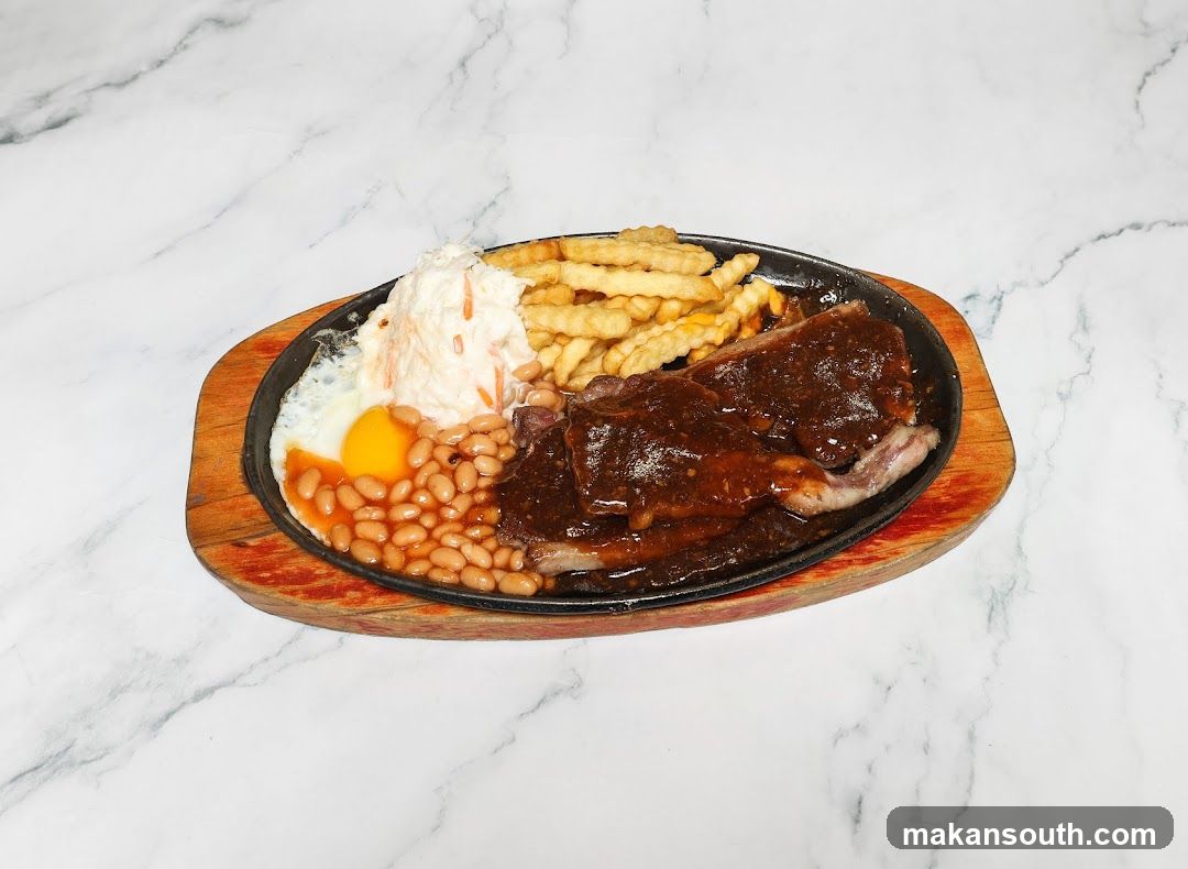 Sizzling Steak Platter with Fries, Beans and Egg