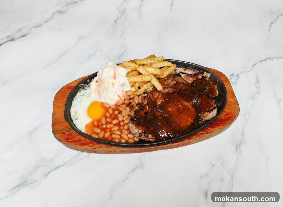 Sizzling Steak Platter with Fries, Beans and Egg