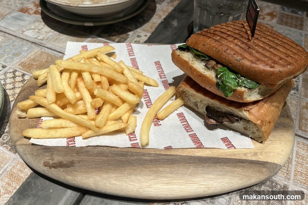 Sandwich and Fries on Wooden Board
