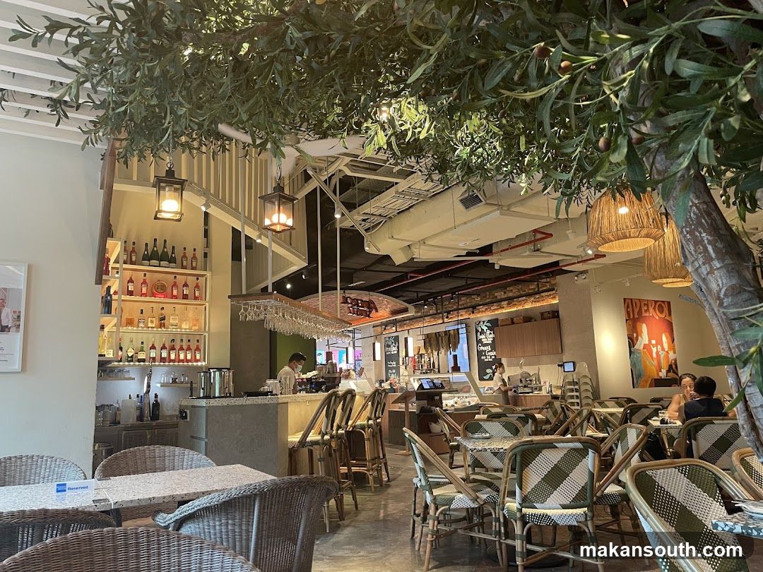 Interior of a cafe with olive tree decor