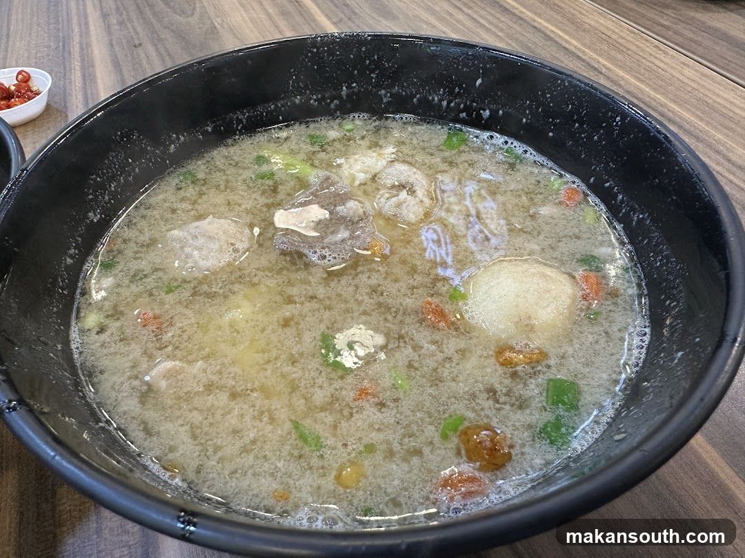 Bowl of Soup with Meatballs and Vegetables