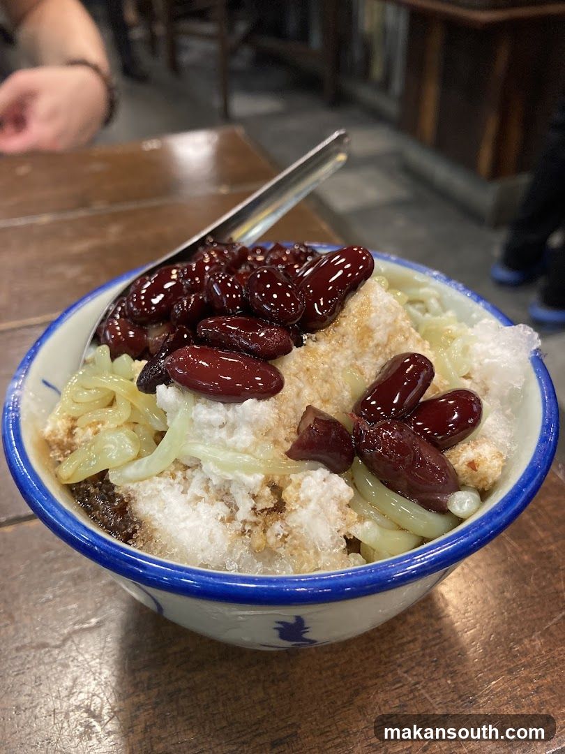Bowl of shaved ice dessert with red beans and toppings