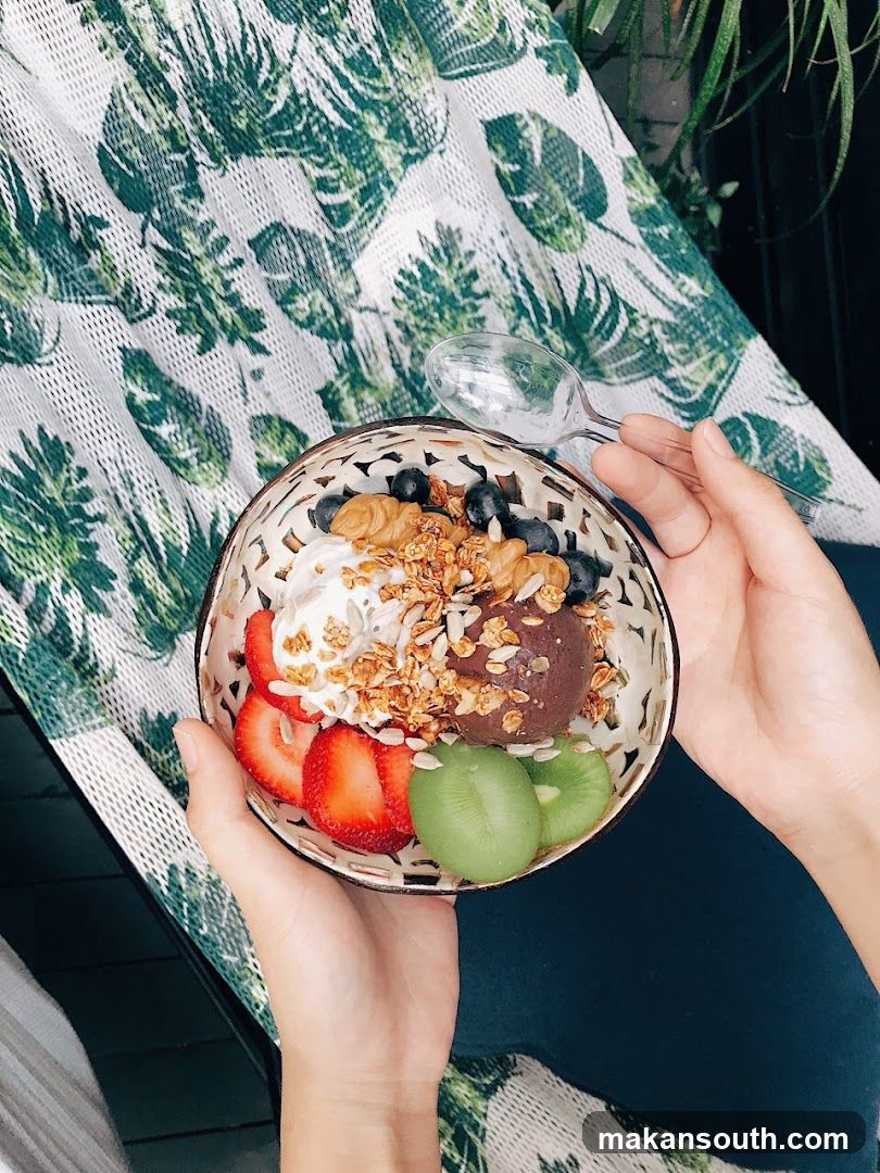 A bowl of acai with fruit and granola