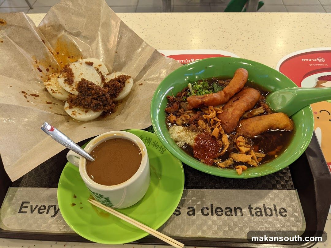 Food Tray with Noodles, Rice Cakes, and Coffee