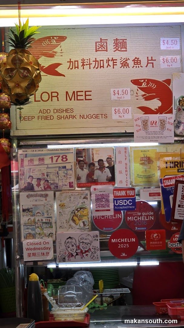Food stall with menu and awards