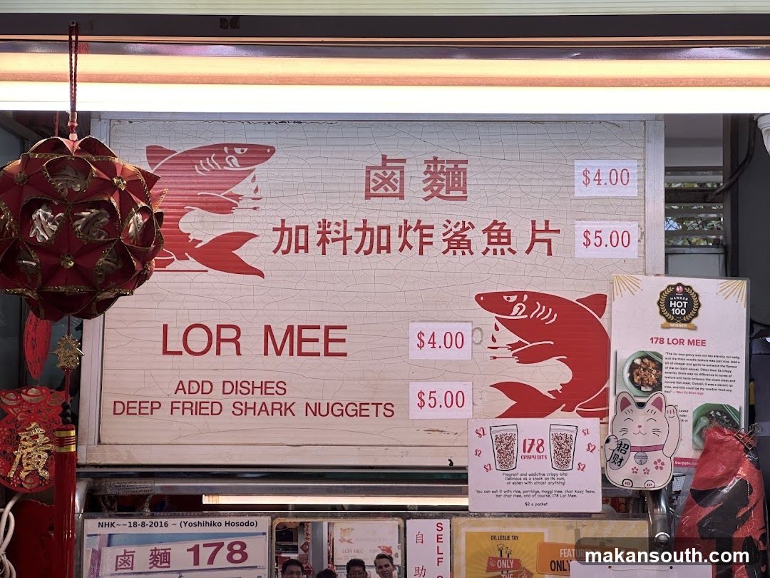 Food stall menu with shark graphics