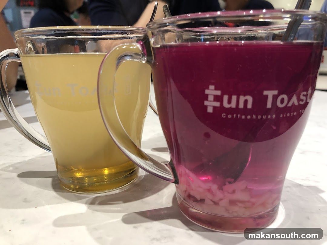 Two mugs of colorful beverages at Fun Toast Coffeehouse