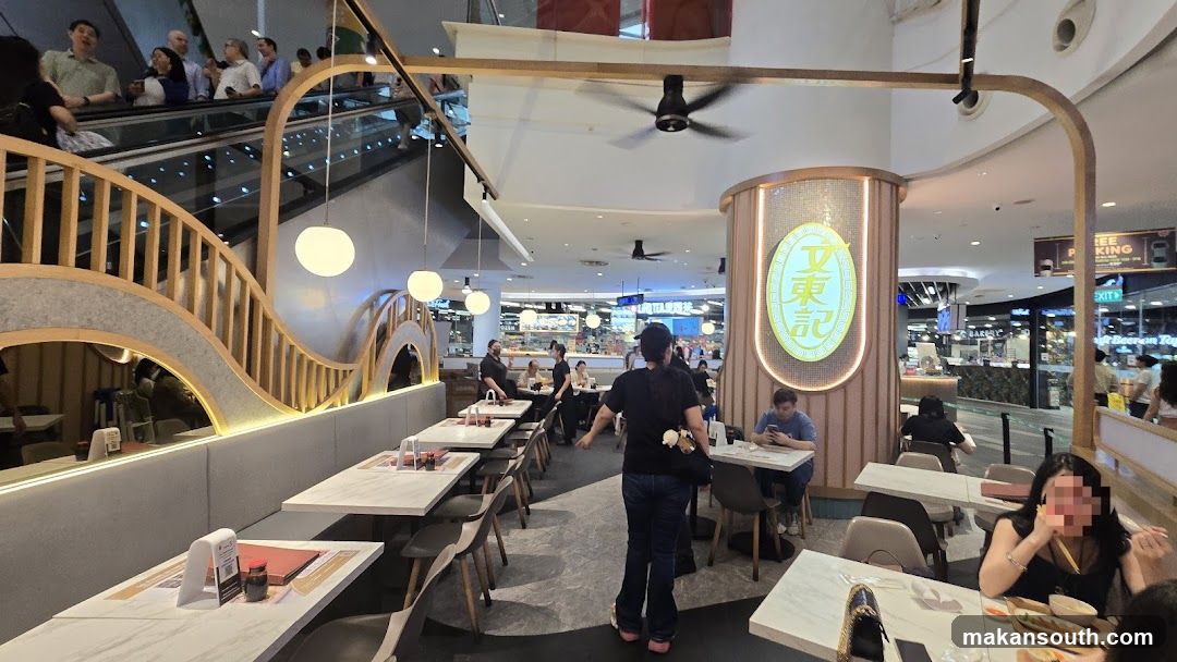Restaurant Interior with Staircase and Dining Area