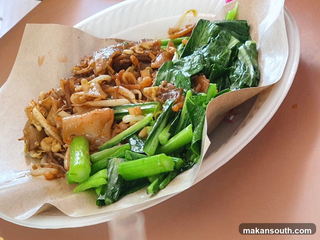 Plate of Stir-fried Noodles and Greens