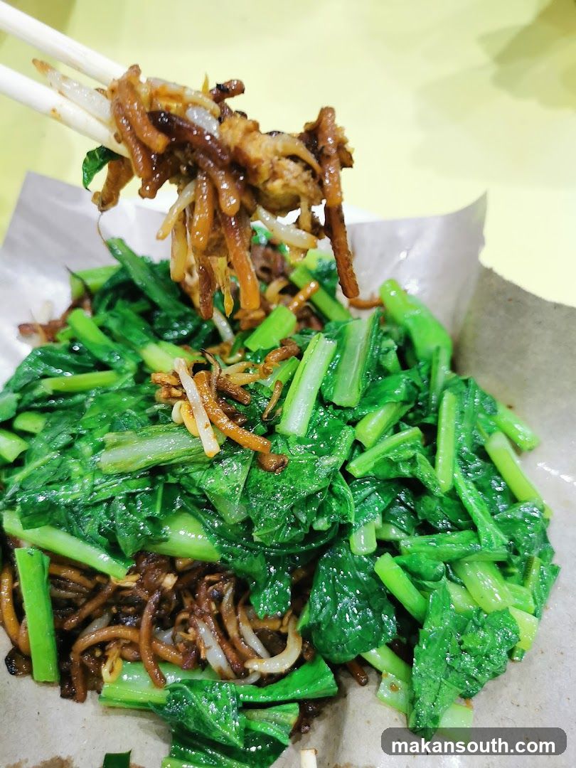 Stir-fried noodles with greens
