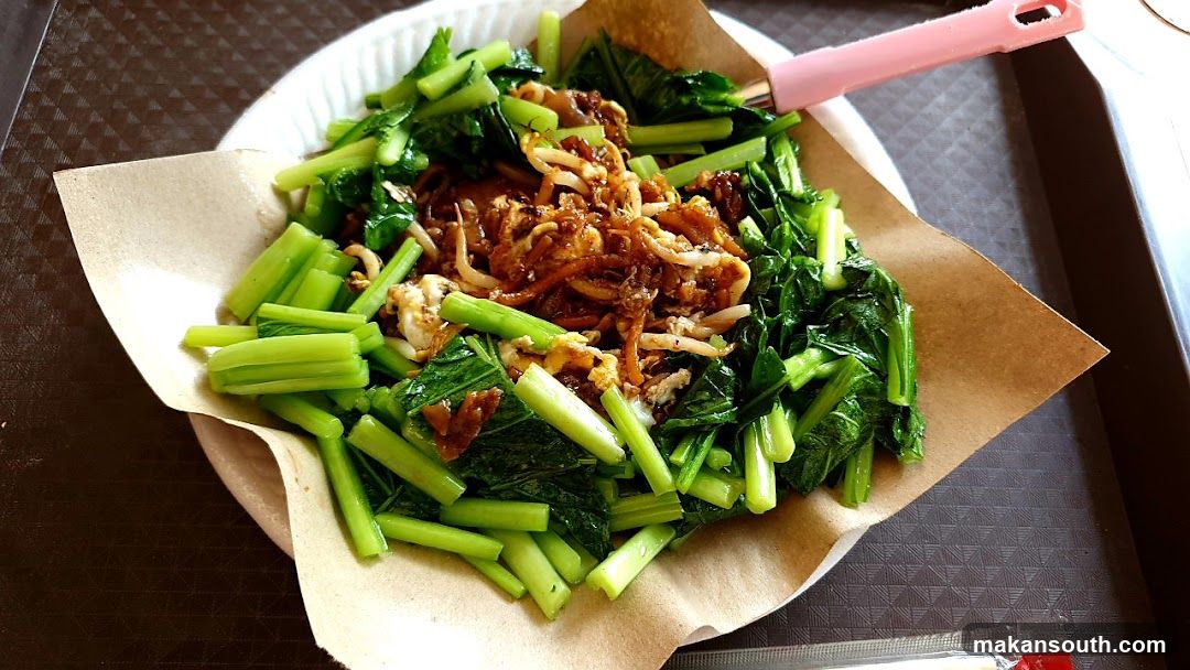 Stir-fried greens with fried shallots and egg