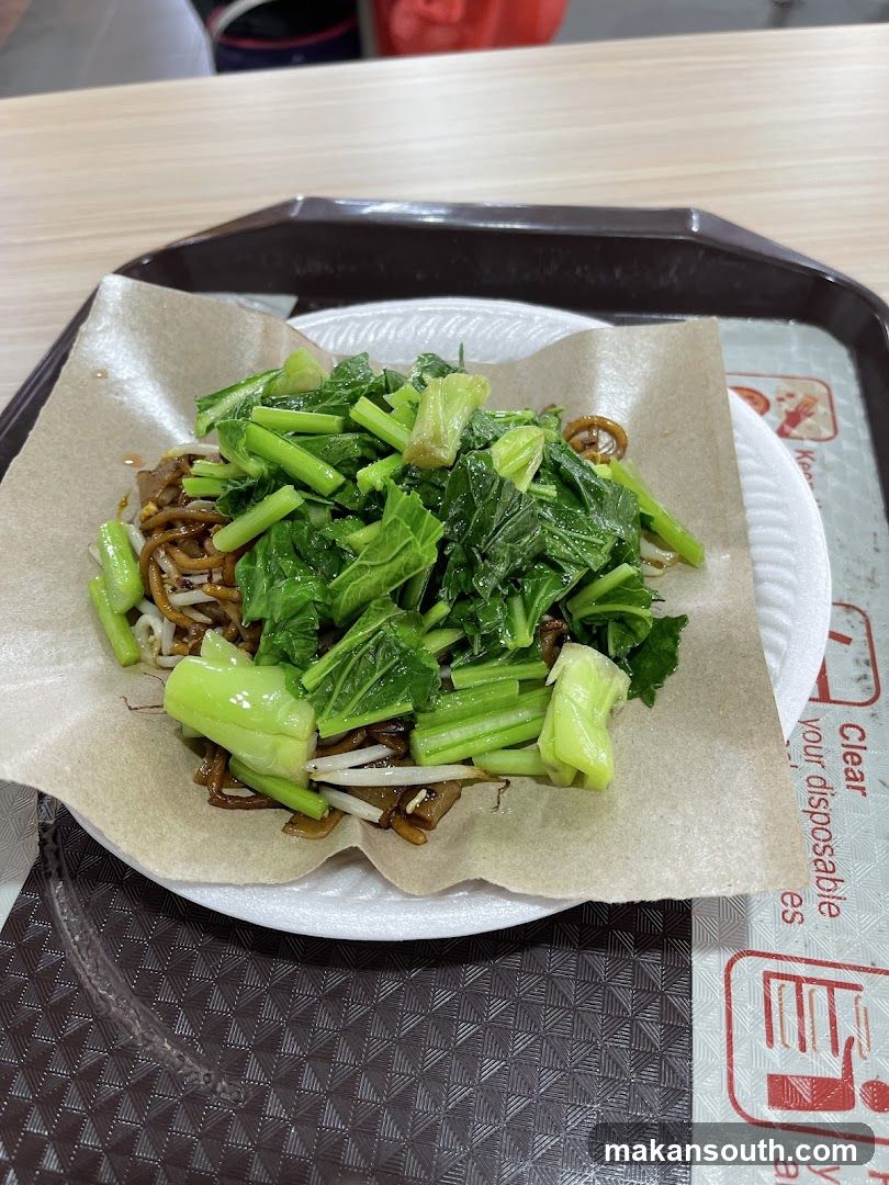 Stir-fried vegetables and noodles on a tray