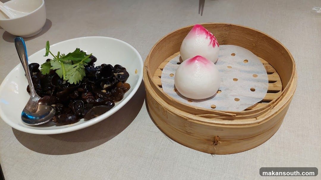 Dish with black fungus and steamed buns