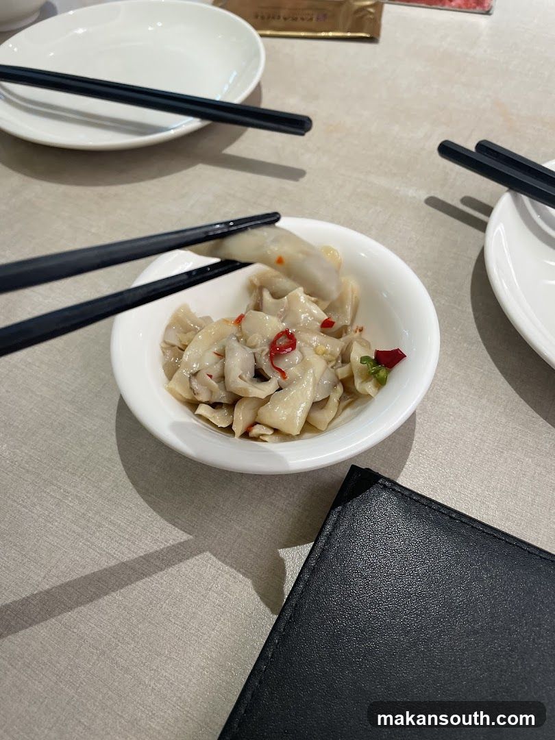Dining Table with Dumplings and Chopsticks