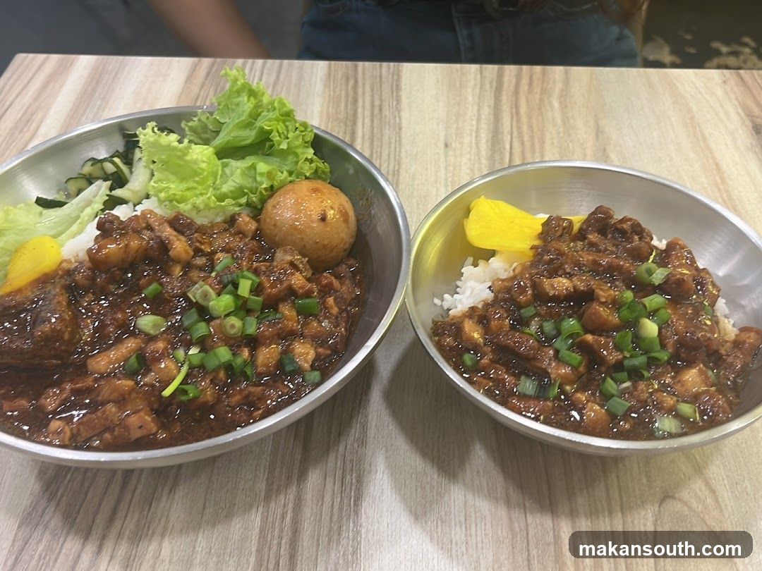 Two bowls of savory rice dish with toppings