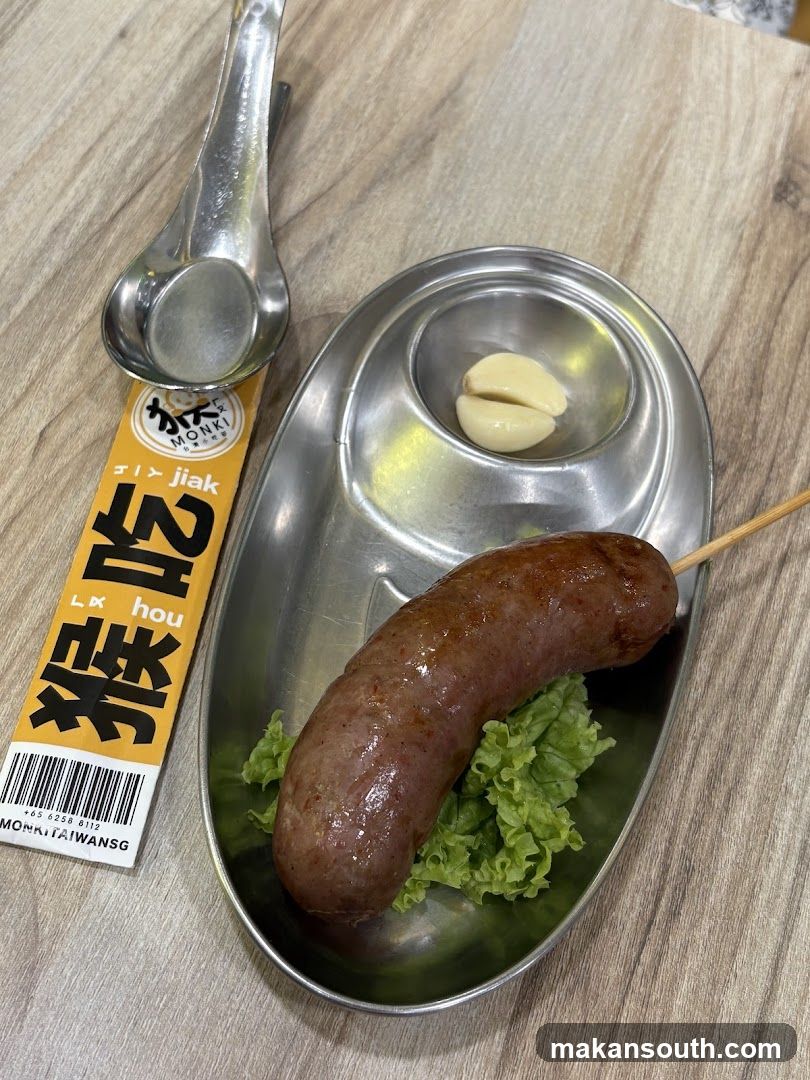 Sausage on skewer with garlic and lettuce