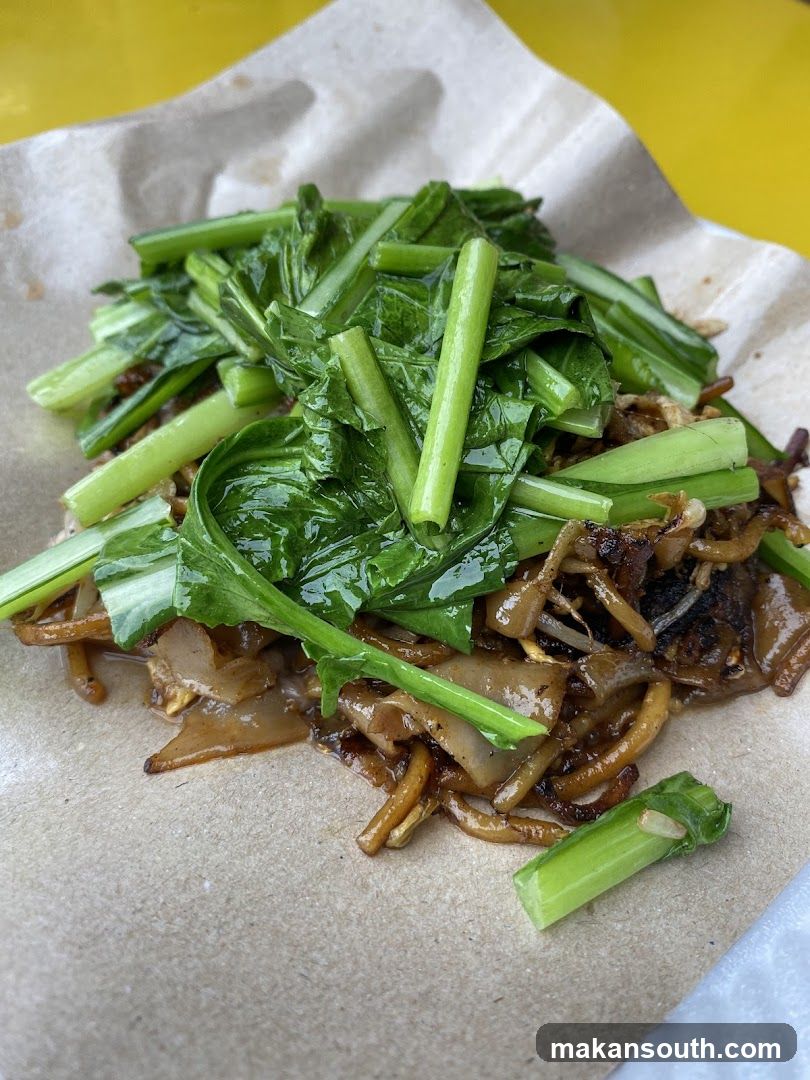 Stir-fried noodles with greens