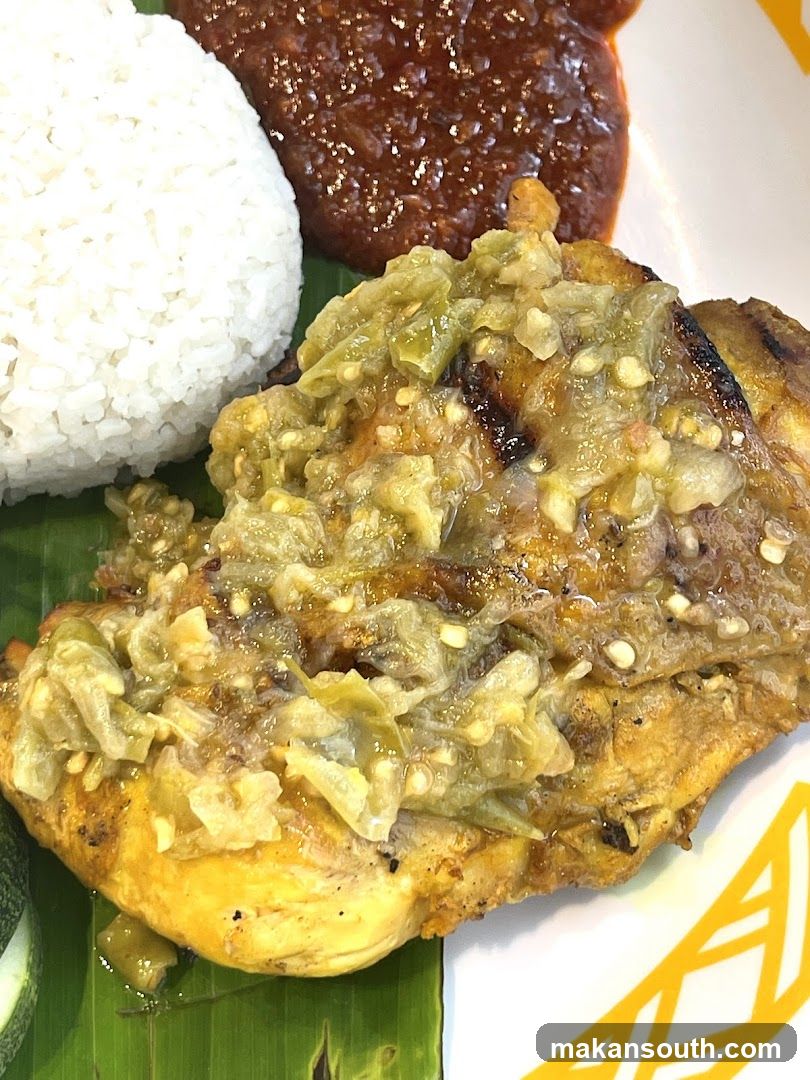 Nasi Lemak Plate with Fried Egg and Cucumber Slices