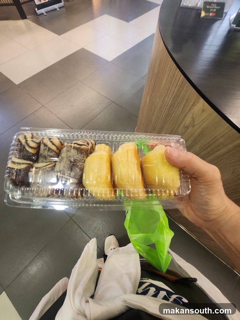 Hand holding packaged pastries