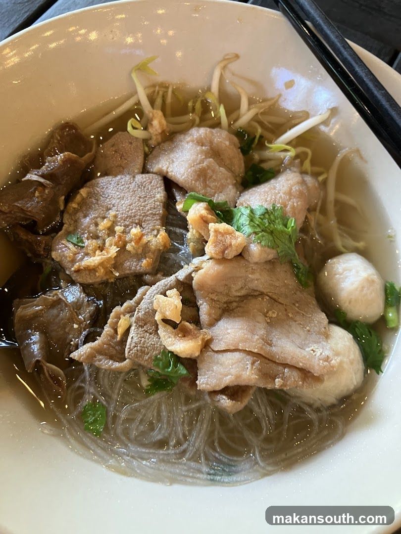 Bowl of Noodle Soup with Meat and Vegetables