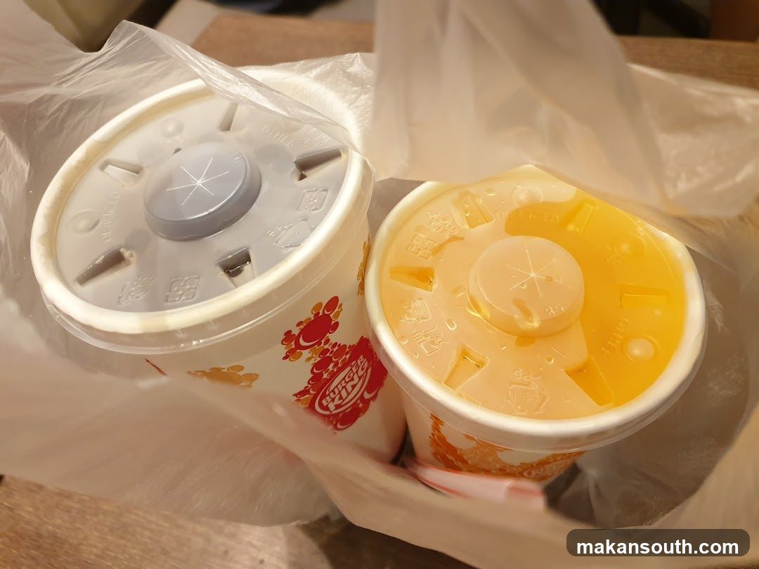 Two beverage cups in a plastic bag