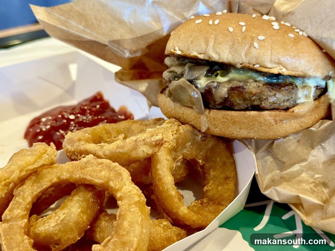 Burger with Onion Rings and Ketchup