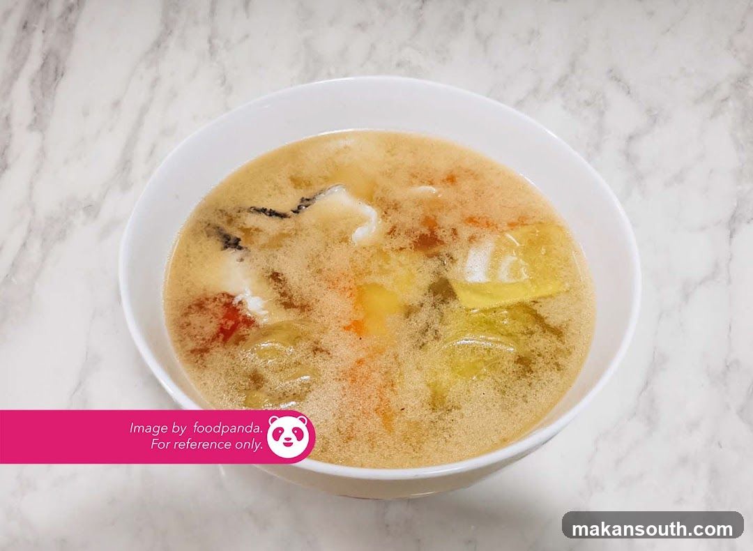 Bowl of Soup with Broth and Vegetables