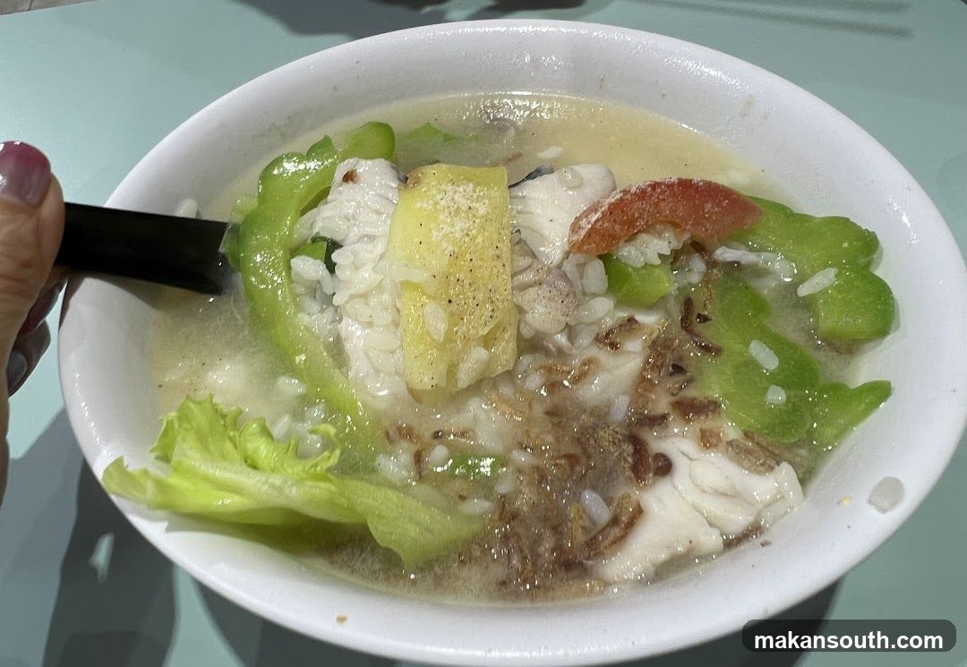 Bowl of Fish Soup with Rice and Vegetables