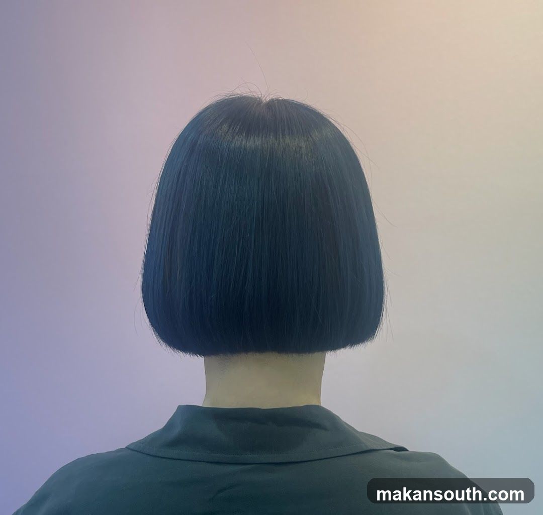 Back of head with blue bob haircut