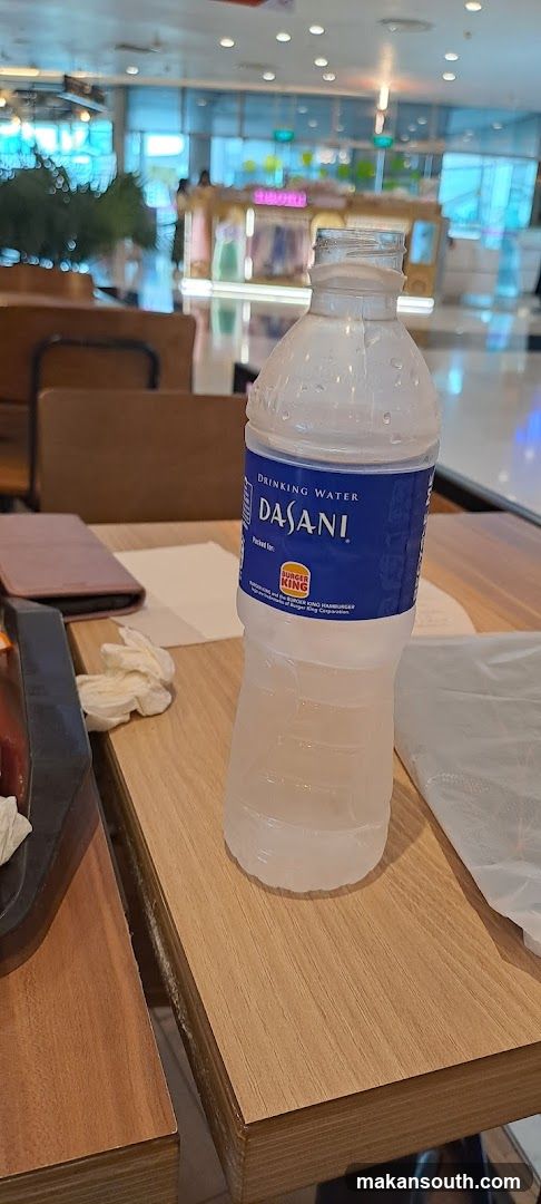 Dasani Water Bottle on Table
