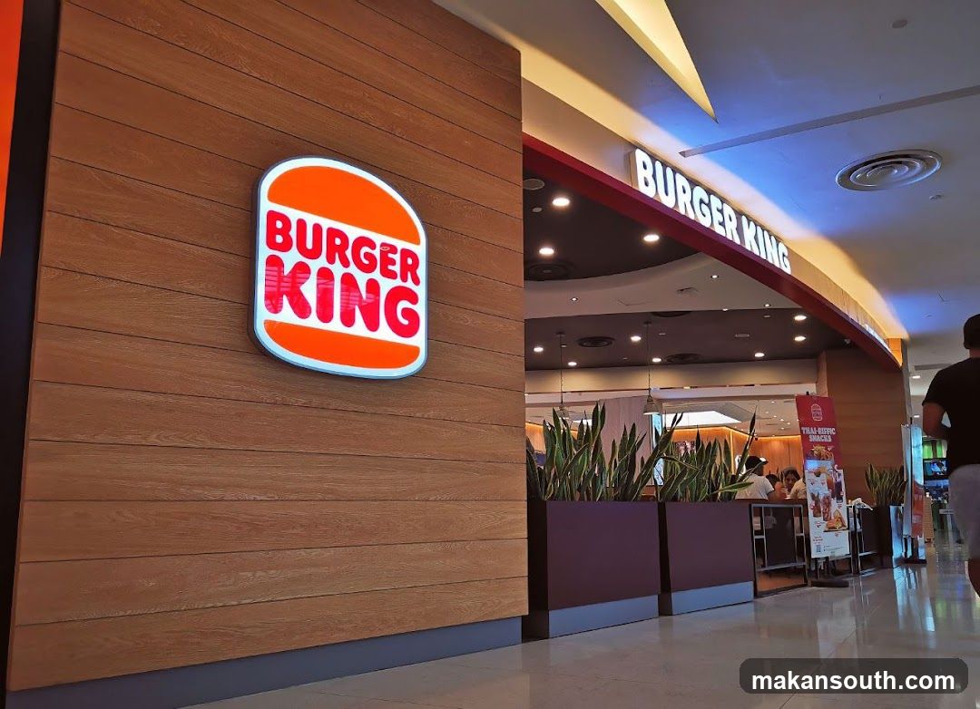 Photo of physical exterior entrance/storefront facade with visible signage on building.