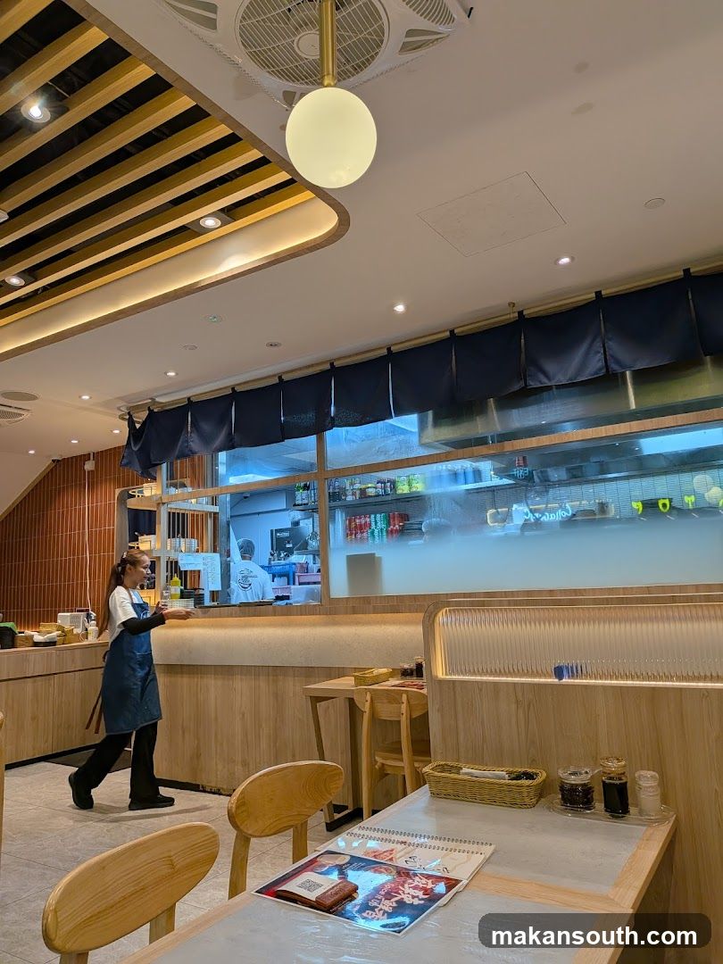 Restaurant Interior with Staff and Kitchen View