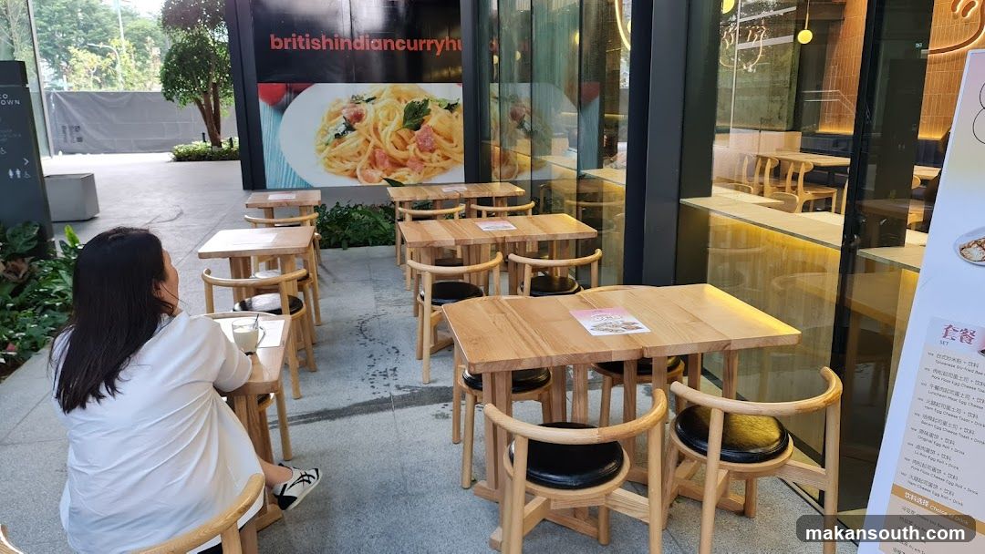 Outdoor Dining Area with Menu Board