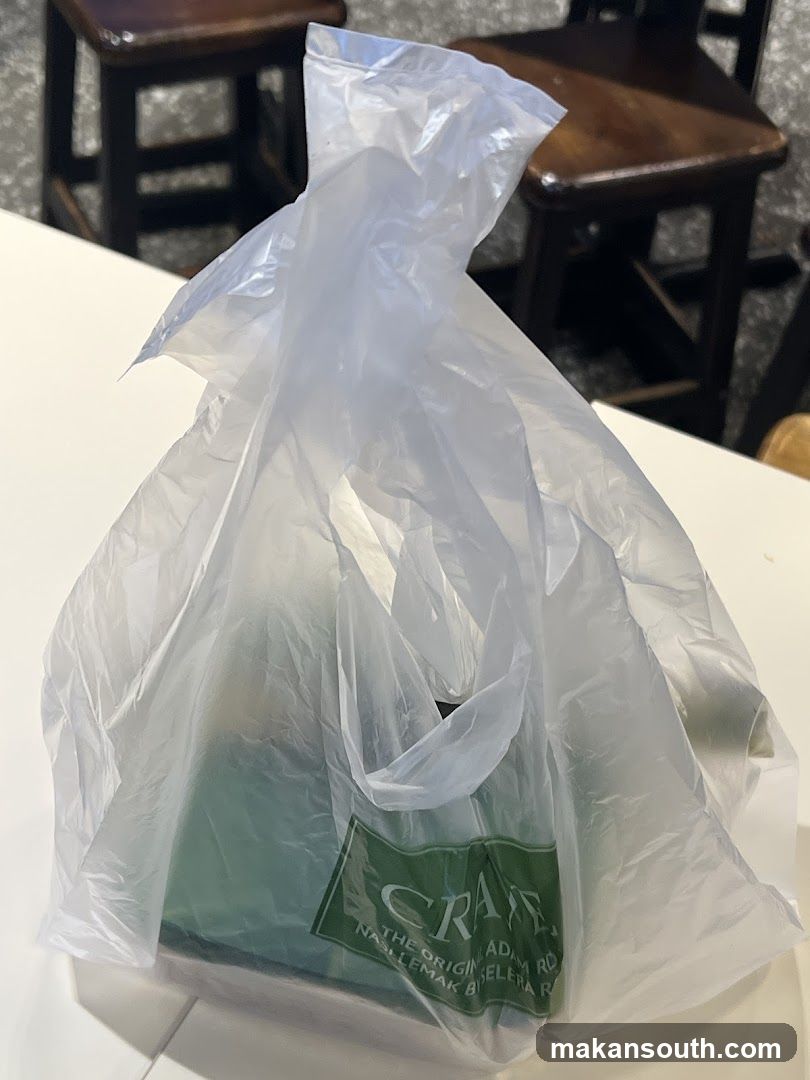 Plastic bag with green item