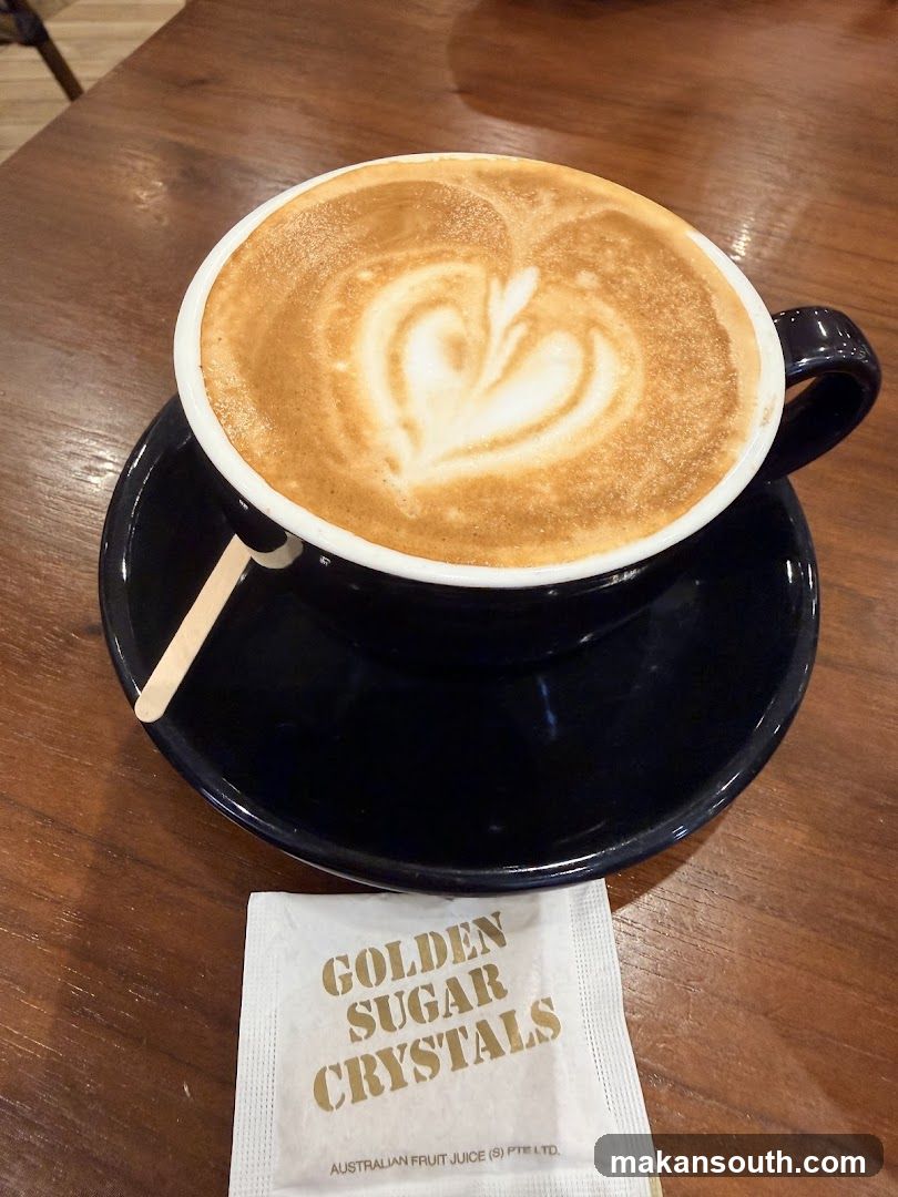Latte with Latte Art and Sugar Packet