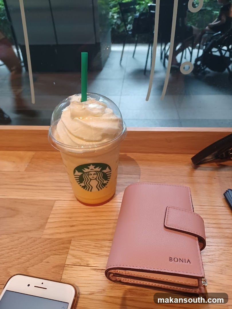 Starbucks Drink and Wallet on Table