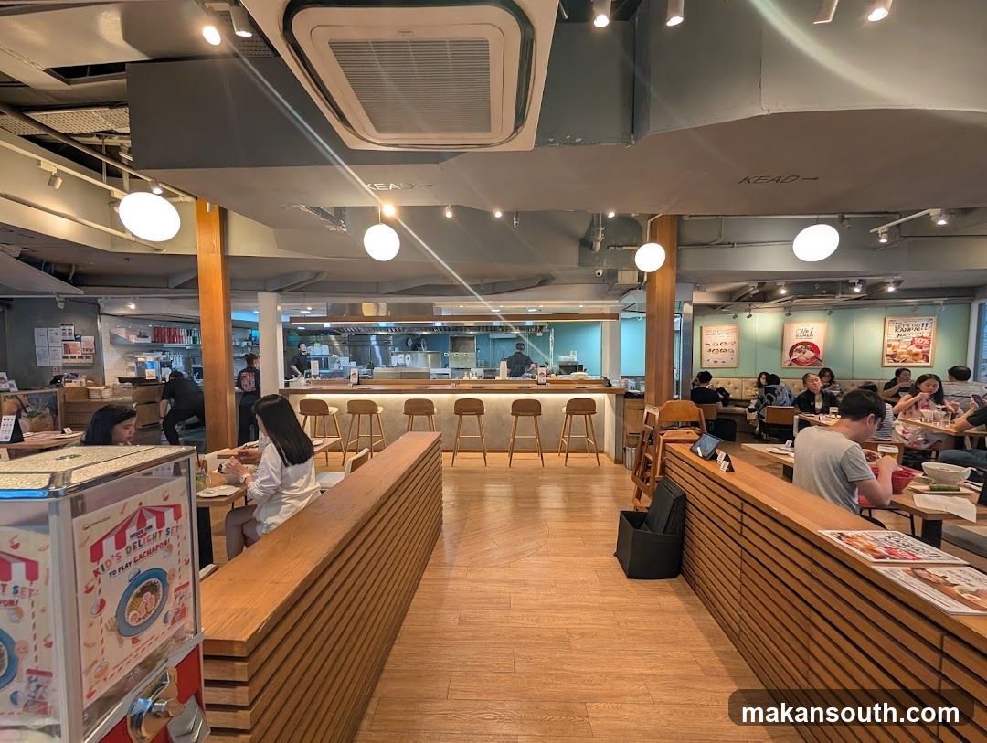 Restaurant Interior with Wooden Seating and Counter Service Area