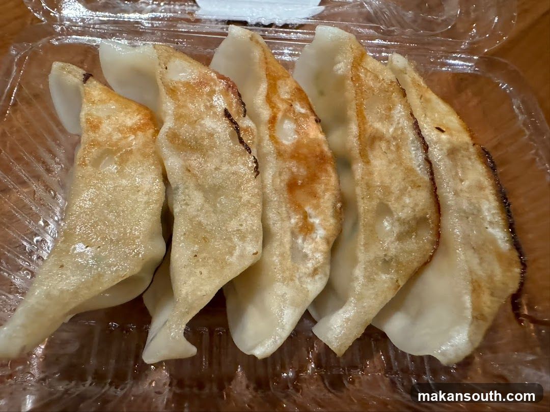 Gyoza in plastic container