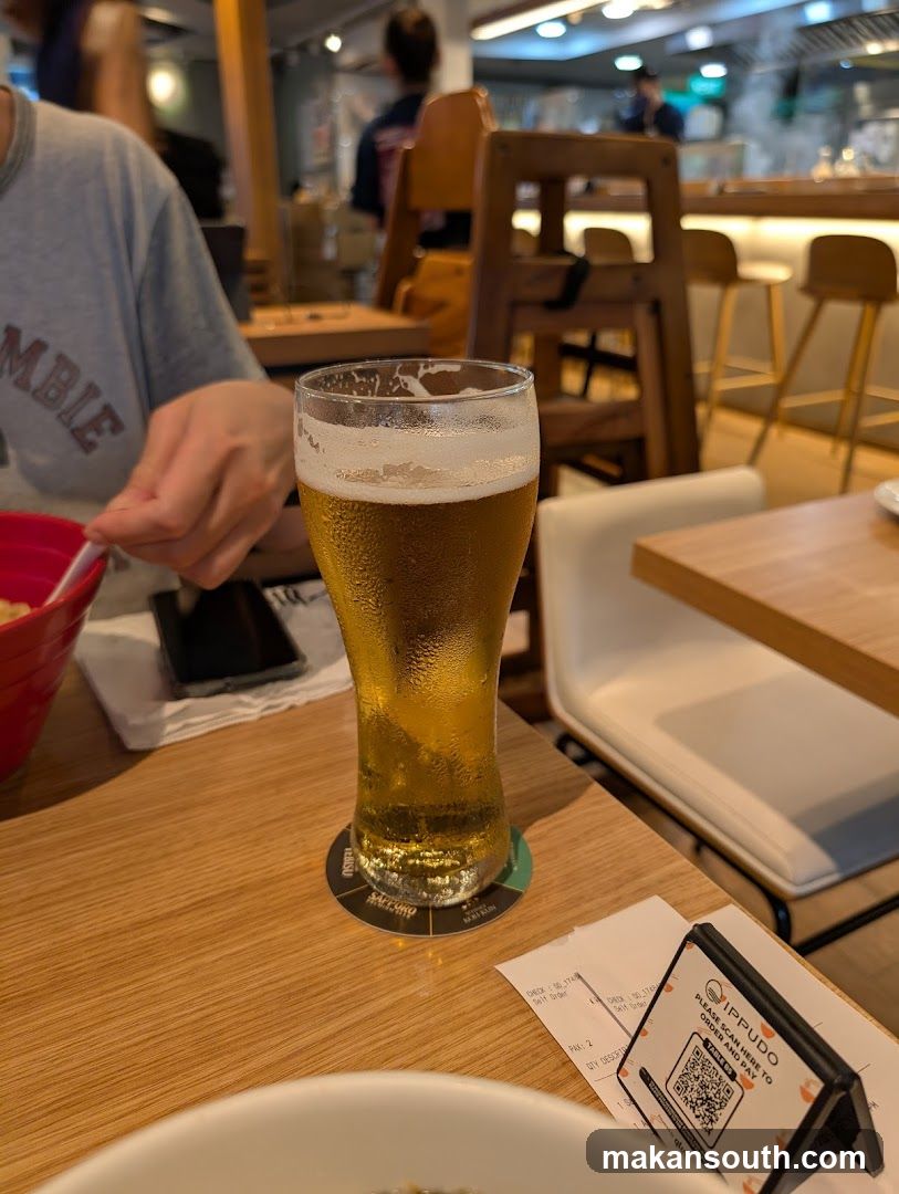 Beer and Food at Restaurant Table