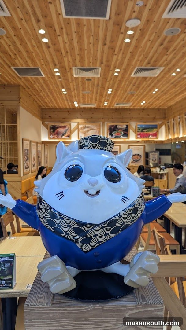 Cat mascot in restaurant interior