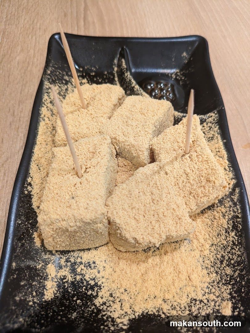 Sugared Cubes on Black Plate