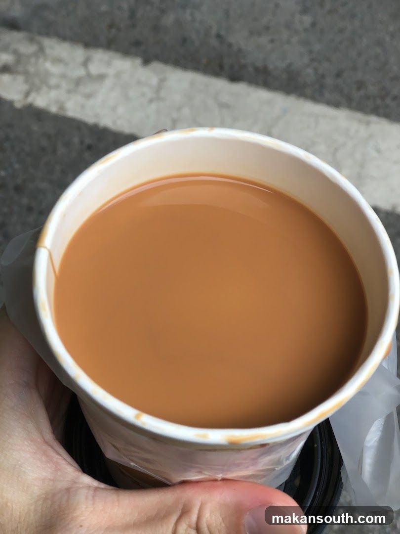 Hand holding a cup of tea