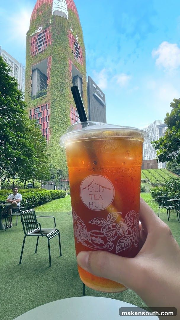 Iced Tea Drink with City Background